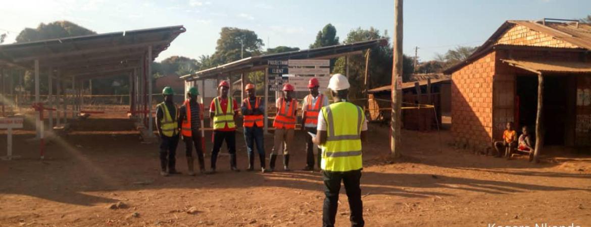 Tool box meeting conducted at Kagera Nkanda Village in Kigoma region where a 40kWp PV plant was under construction. This meeting is essential for health and safety awareness among team members implementing the project